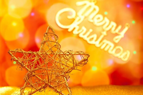 Metalowa Choinka-gwiazda na tle bokeh i napis Merry Christmas